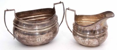 George V sugar basin and milk jug, each of girdled oval form with contemporary initials, combined