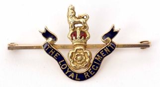 A Regimental bar brooch stamped 9ct with translucent blue and red enamel detail