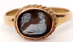 Antique 18ct gold hardstone cameo ring depicting a carved figure, bezel set and raised within a rope