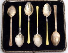 Cased set of six Elizabeth II silver gilt and enamelled coffee spoons, each with lemon yellow enamel