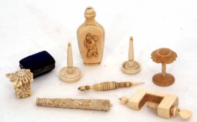 Mixed Lot: a bone cylindrical case, coquille lace bobbin, ivory table clamp, ivory tape measure