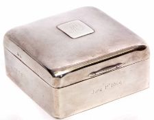 Early 20th century silver table cigarette box of polished square form with later applied