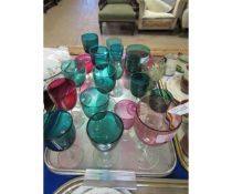 CRANBERRY AND GREEN BOWLED GLASSES OF VARYING SIZES