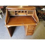 OAK FRAMED TAMBOUR FRONTED DESK WITH SINGLE PEDESTAL FITTED WITH FOUR DRAWERS