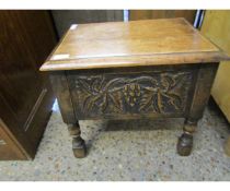 EARLY 20TH CENTURY OAK FRAMED LIFT UP TOP SEWING BOX WITH CARVED PANELS