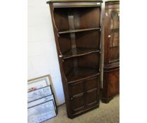 DARK STAINED ERCOL CORNER CUPBOARD WITH TWO FIXED SHELVES AND PANELLED CUPBOARD DOOR