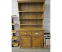 WAXED PINE DRESSER WITH THREE FIXED SHELVES AND PANEL BACK, BASE WITH TWO DRAWERS OVER TWO