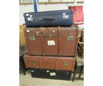 TWO BROWN REXINE AND BEECHWOOD BOUND TRUNKS TOGETHER WITH A FURTHER TIN TRUNK AND BLUE LEATHERETTE