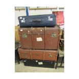 TWO BROWN REXINE AND BEECHWOOD BOUND TRUNKS TOGETHER WITH A FURTHER TIN TRUNK AND BLUE LEATHERETTE