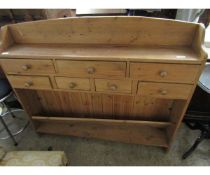 PINE FRAMED SHELF UNIT WITH SEVEN DRAWERS WITH TURNED HANDLES AND OPEN SHELF