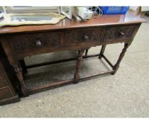 EARLY 20TH CENTURY OAK FRAMED DRESSER BASE WITH THREE HEAVILY CARVED DRAWERS ON TURNED SUPPORTS