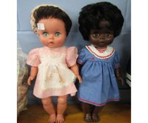 Two moulded “Chiltern” dolls each complete with original clothes, one black and one white, height of