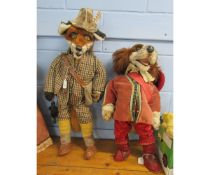 Two large plush display characters depicting a fox and a spaniel, both clothed, the larger approx