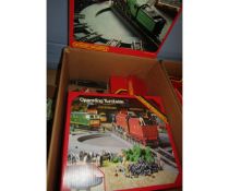 Box containing various boxed 1980s/1990s Hornby track side accessories including 2 x operating