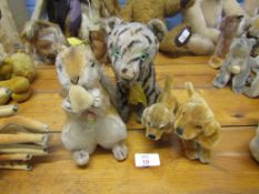 Collection of four various modern Steiff plush figures comprising tiger, squirrel and two dogs,