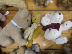 Collection of four various soft toys from a 1906s lion to a modern plush bear