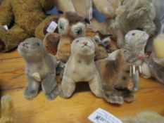 Collection of six modern small Steiff plush figures comprising four walruses and two owls, largest