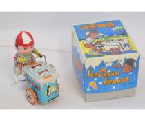 Late 20th century boxed tinplate ice cream seller on tricycle, height approximately 4 1/2 inches