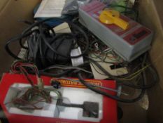 Box containing various 00 gauge electrical accessories including Hornby and other switches,