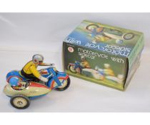 Late 20th century tinplate clockwork powered motorcycle with sidecar, height approximately 5