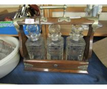 OAK FRAMED AND SILVER PLATED MOUNTED THREE BOTTLE TANTALUS