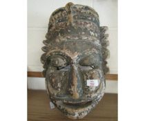 EASTERN CARVED TRIBAL MASK IN SOFTWOOD WITH PAINTED DETAIL