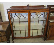 EARLY 20TH CENTURY WALNUT BOW FRONTED ASTRAGAL GLAZED CORNER CUPBOARD RAISED ON CLAW AND BALL FEET