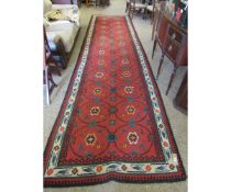 GOOD QUALITY MODERN CARPET WITH RED GROUND AND CIRCULAR REPEATING FLORAL LOZENGE TO CENTRE WITH