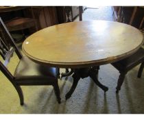 VICTORIAN OVAL WALNUT LOO TABLE SUPPORTED ON FOUR TURNED COLUMNS AND A QUATREFOIL BASE