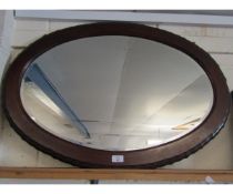 MAHOGANY FRAMED OVAL WALL MIRROR WITH SHAPED EDGE