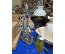 MANUALLY OPERATED LEMON PRESS AND STAINLESS STEEL OIL JUG