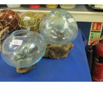 THREE RUSTIC GLASS BOWLS ON TREEN STANDS