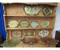 TWELVE GOOD QUALITY VARYING SIZED PAINTED TWO-HANDLED TRAYS