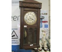 MID-20TH CENTURY OAK FRAMED DIAL CLOCK WITH SILVERED DIAL AND GLASS PANELLED DOOR