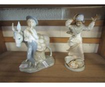 TWO LLADRO TYPE MODELS OF A BOY BY A DONKEY AND A FURTHER LADY WITH ARMS RAISED