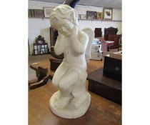 WHITE RESIN MODEL OF A SEATED CHERUB OR PUTTI