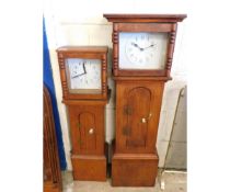 TWO OAK FRAMED SMALL PROPORTIONED LONG CASE CLOCKS (2)