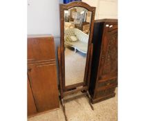 EARLY 20TH CENTURY OAK FRAMED AND CARVED CHEVAL MIRROR ON PAD FEET