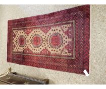 GOOD QUALITY MODERN BOKHARA TYPE CARPET WITH CENTRAL LOZENGE WITH MULTI-GULL BORDER, IN RED AND