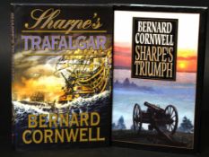 BERNARD CORNWELL: 2 titles: SHARPE'S TRIUMPH, New York [1999], 1st edition, signed, original cloth