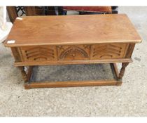 OAK FRAMED SMALL PROPORTIONED LIFT UP TOP COFFER WITH CARVED FRONT ON A TURNED STAND
