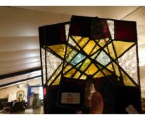 THREE SMALL LEADED AND GLAZED STAINED GLASS WINDOWS