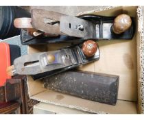 BOX CONTAINING TWO WOOD WORKING PLANES AND A FURTHER SHARPENING STONE