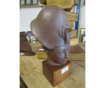 EGYPTIAN RESIN HEAD ON A TEAK BLOCK