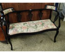EBONISED TWO-SEATER COTTAGE SOFA WITH PIERCED URN BACK WITH ROSE UPHOLSTERED SEAT AND HEAD REST WITH