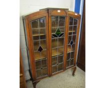 EARLY 20TH CENTURY OAK FRAMED CABINET WITH LEADED AND GLAZED DOORS RAISED ON SHAPED FEET