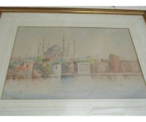 WATERCOLOUR SIGNED HERIE OF AN EASTERN SCENE IN A GILT FRAME