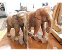 TWO EASTERN CARVED MODELS OF ELEPHANTS