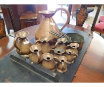 GRADUATED SET OF TEN COPPER MEASURES TOGETHER WITH FOUR COPPER AND BRASS GRADUATED SAUCEPANS (14)