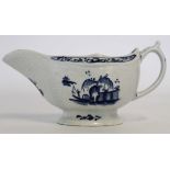 Lowestoft sauce boat, circa 1765, decorated with a Chinese island pattern and a man on a sampan, the